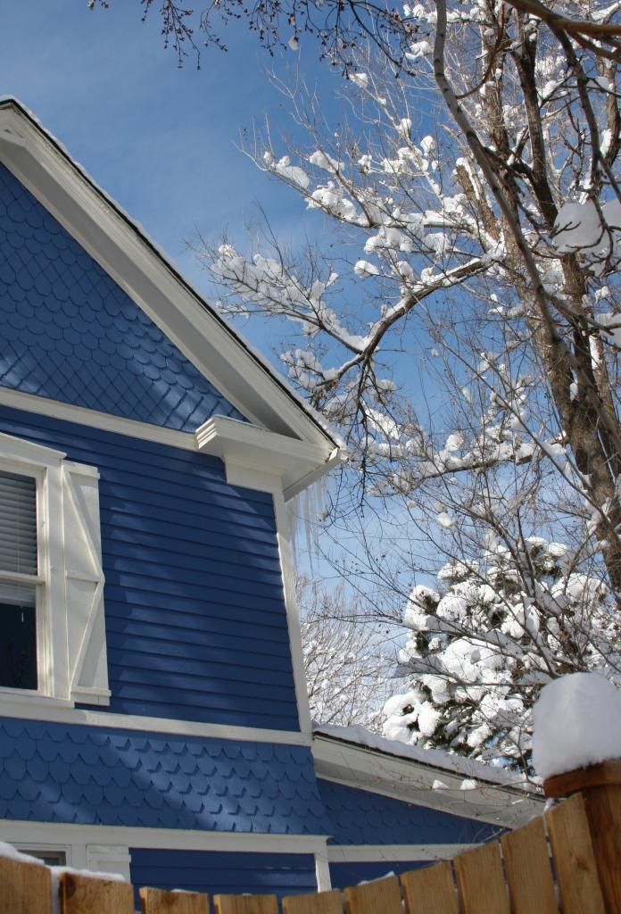 blue house in snow